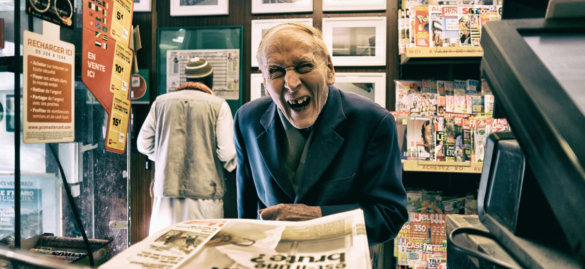MrWolf News Elderly man buying a newspaper